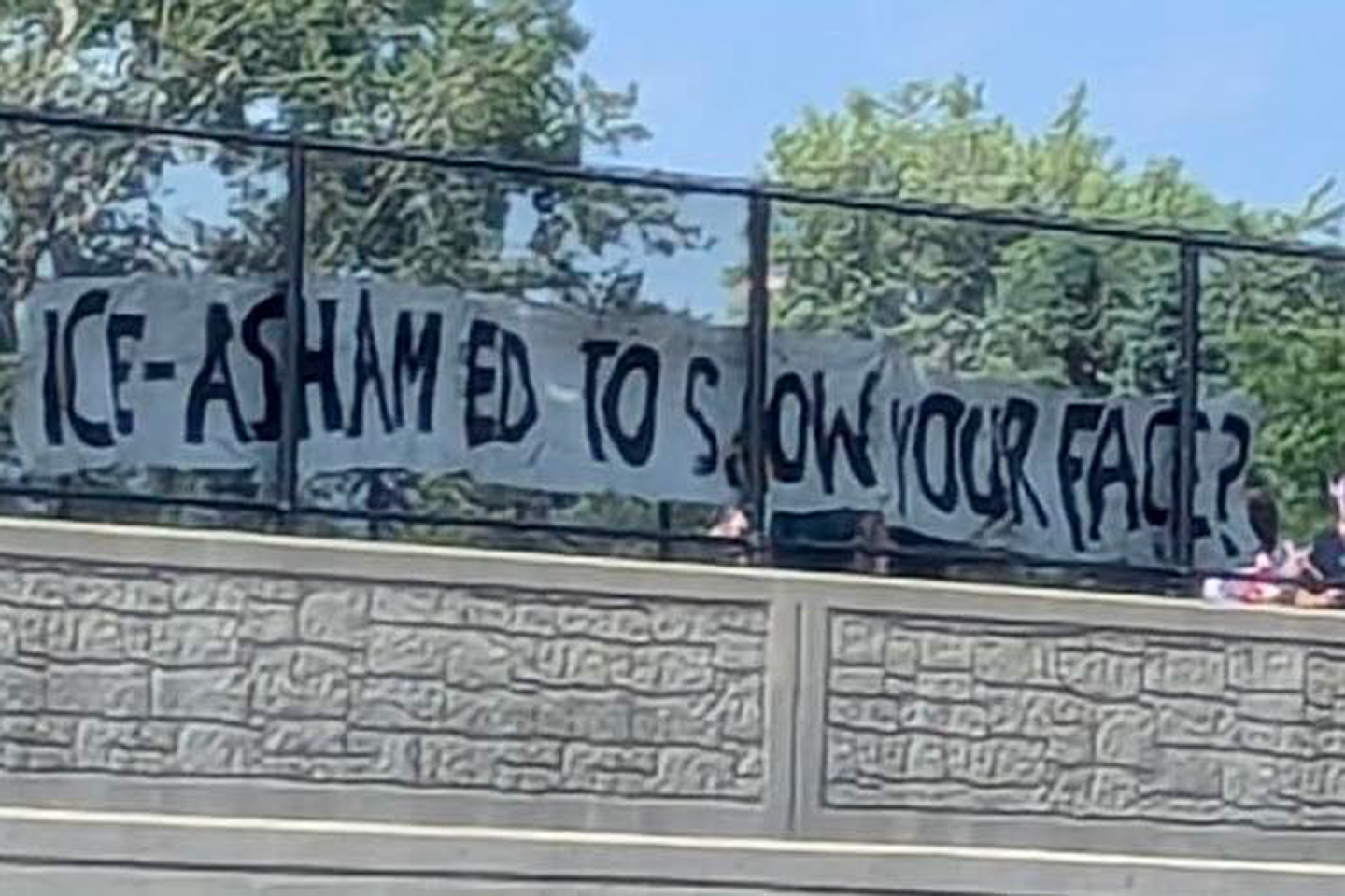 WNYBB.org banner hung on a Western New York overpass, with an American flag flying beside it.